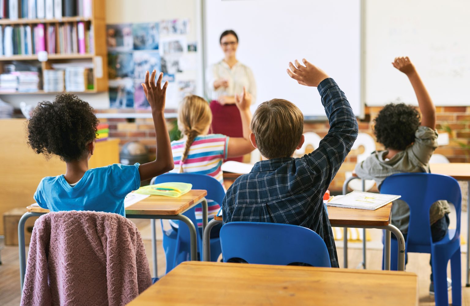 Pupils raising their hands