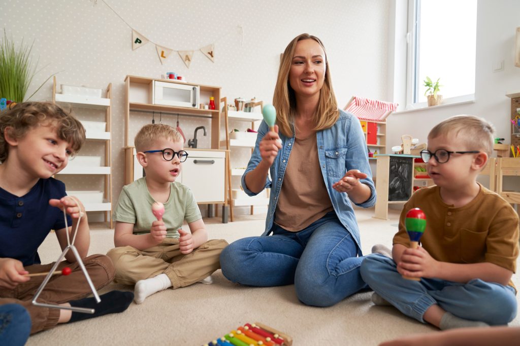 Adult playing with her class