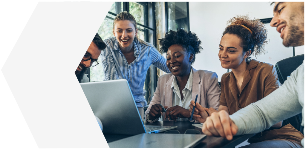 Employees working together at laptop