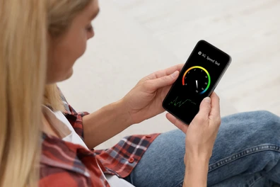 Employee looking at mobile speeds