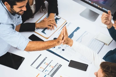 Employees sharing a high five