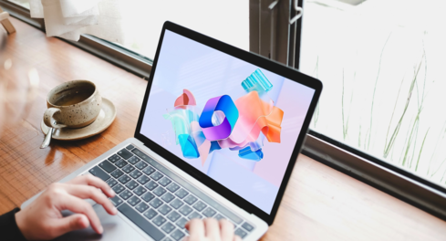 Laptop on a desk near window, Microsoft 365