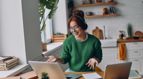 Woman on two laptops